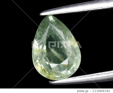 natural green sapphire gem on the background natural green sapphire gem on the background 111668192