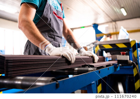 Worker at factory measures works metal production industrial Worker at factory measures works metal production industrial 111670240