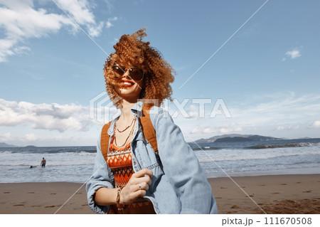Beach Woman: Smiling Hippie, Happy and Free, Enjoying Nature's Portrait in the Sun Beach Woman: Smiling Hippie, Happy and Free, Enjoying Nature's Portrait in the Sun 111670508