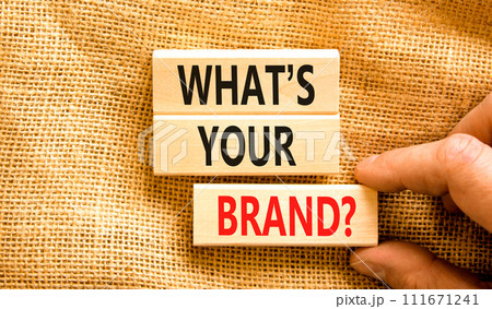 Branding and what is your brand symbol. Concept words What is your brand on beautiful blocks. Beautiful canvas background. Businessman hand. Business branding what is your brand concept. Copy space. Branding and what is your brand symbol. Concept words What is your brand on beautiful blocks. Beautiful canvas background. Businessman hand. Business branding what is your brand concept. Copy space. 111671241