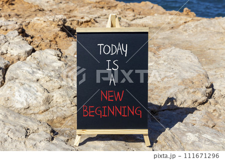 Today is a new beginning symbol. Concept words Today is a new beginning on beautiful blackboard. Beautiful stone sea background. Business today is new beginning concept. Copy space. Today is a new beginning symbol. Concept words Today is a new beginning on beautiful blackboard. Beautiful stone sea background. Business today is new beginning concept. Copy space. 111671296