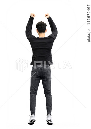 A man, on a white background, in full height, jumps 111672467