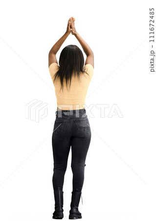 A woman, on a white background, in full height, claps 111672485