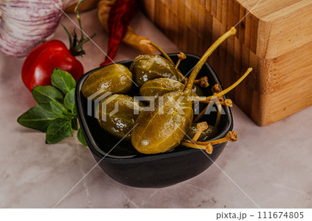 Marinated Caper Berries snack appetiser 111674805