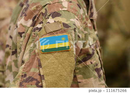 Rwanda flag on soldiers arm. Rwanda troops (collage) 111675266
