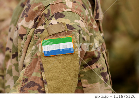 Sierra Leone flag on soldiers arm. Sierra Leone troops (collage) 111675326