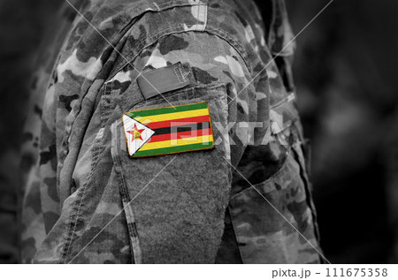 Zimbabwe flag on soldiers arm. Zimbabwe troops (collage) 111675358