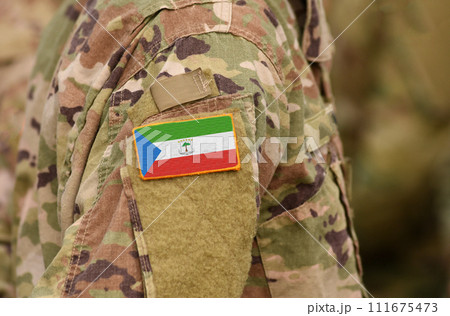 Equatorial Guinea flag on soldiers arm. Equatorial Guinea troops (collage) 111675473