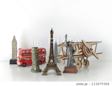 Travel and tourism concept with souvenirs from around the world. Planning summer vacation. Trip concept Travel and tourism concept with souvenirs from around the world. Planning summer vacation. Trip concept 111675568