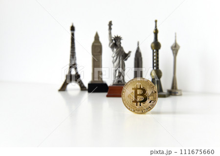 Bitcoin concept, cryptocurrencies. World economy concept. Golden coin bitcoin and souvenir from around the world. Bitcoin concept, cryptocurrencies. World economy concept. Golden coin bitcoin and souvenir from around the world. 111675660