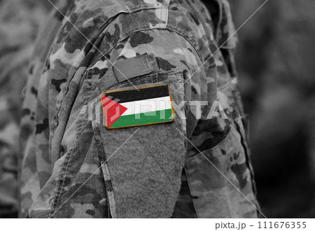 State of Palestine flag on soldiers arm (collage). 111676355