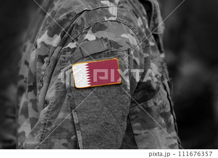 Flag of Qatar on soldiers arm (collage). 111676357