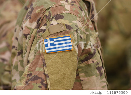 Greece flag on soldiers arm (collage). Greece flag on soldiers arm (collage). 111676390