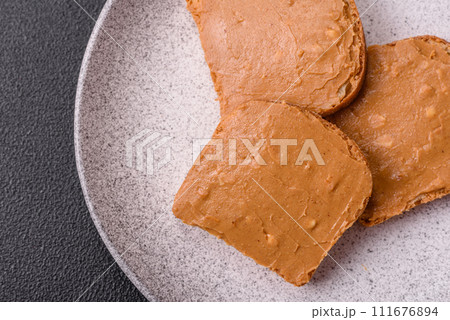 Delicious hearty sandwich with toast bread and peanut butter Delicious hearty sandwich with toast bread and peanut butter 111676894