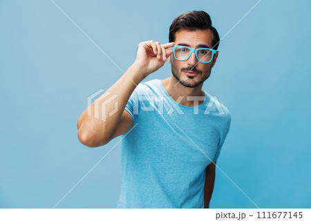 Man fashion trendy background style blue lifestyle beard modern portrait glasses smile t-shirt attractive 111677145