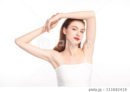 Beautiful Young woman lifting hands up to show off clean and hygienic armpits or underarms on white background, Smooth armpit cleanliness and protection concept Beautiful Young woman lifting hands up to show off clean and hygienic armpits or underarms on white background, Smooth armpit cleanliness and protection concept 111682419