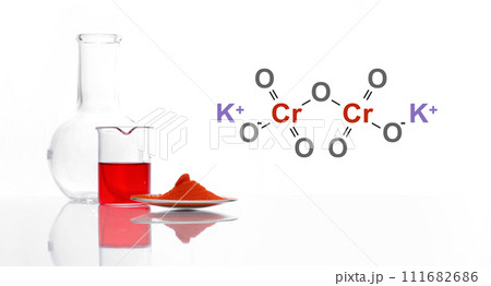 Potassium Dichromate in chemical watch glass place next to red liquid in beaker and Flat Bottom Flask. The structure of a chemical compound is shown on the side. Potassium Dichromate in chemical watch glass place next to red liquid in beaker and Flat Bottom Flask. The structure of a chemical compound is shown on the side. 111682686