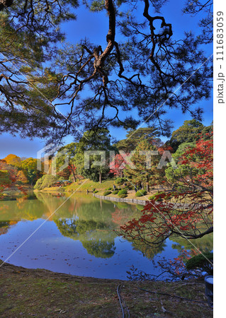 Colorful autumn trees reflecting in calm lake water Nov 29 2023 Colorful autumn trees reflecting in calm lake water Nov 29 2023 111683059