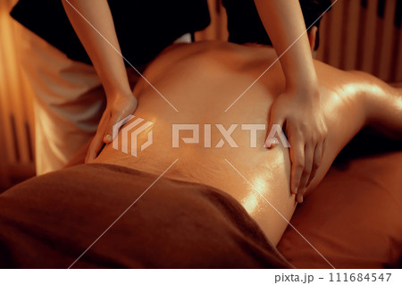Caucasian man customer enjoying relaxing anti-stress massage. Quiescent 111684547