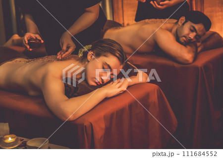 Couple customer having exfoliation treatment in luxury spa. Quiescent 111684552