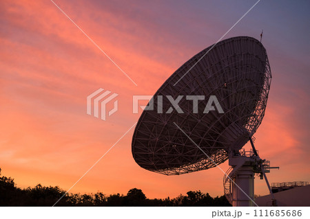 Big Satellite Dish or radio telescope at dusk with twilight sky Big Satellite Dish or radio telescope at dusk with twilight sky 111685686