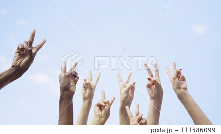 Unrecognizable group of people gesturing victory with the arms Unrecognizable group of people gesturing victory with the arms 111686099