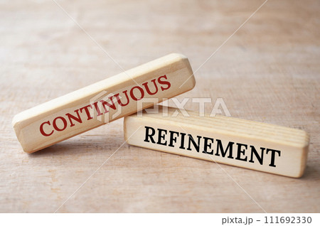 Continuous refinement text on wooden blocks. Operational excellence concept Continuous refinement text on wooden blocks. Operational excellence concept 111692330