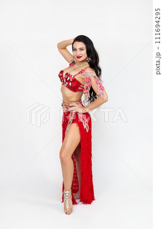 Photo of a middle-aged dancer in a red variety costume Photo of a middle-aged dancer in a red variety costume 111694295