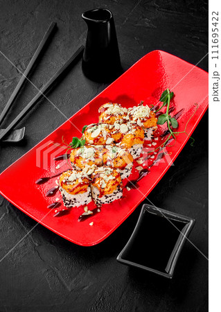 Sushi rolls with cheese and seafood caps and grated parmesan 111695422