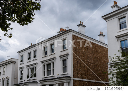 Low angle view of old luxury residential building in London Low angle view of old luxury residential building in London 111695964