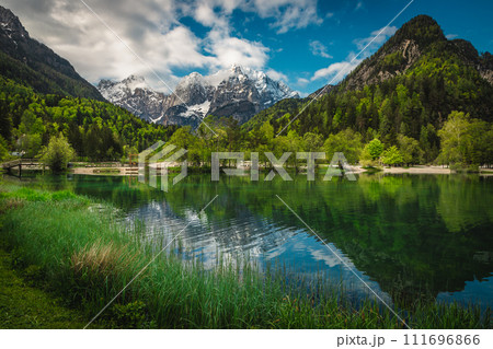 Majestic clean mountain lake and snowy peaks in Slovenia Majestic clean mountain lake and snowy peaks in Slovenia 111696866