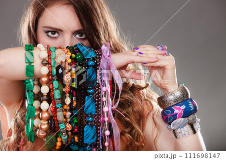 Pretty woman with jewelry necklaces ring bracelets 111698147