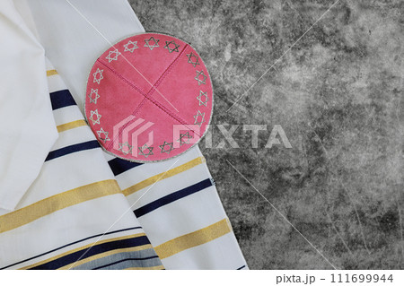 Prayer holy shawl tallit, kippah are symbols of Jewish Orthodox holidays 111699944