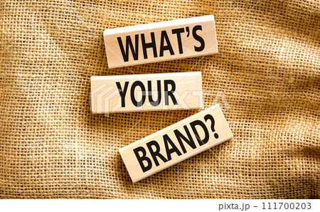 Branding and what is your brand symbol. Concept words What is your brand on beautiful blocks. Beautiful canvas table canvas background. Business branding what is your brand concept. Copy space. 111700203