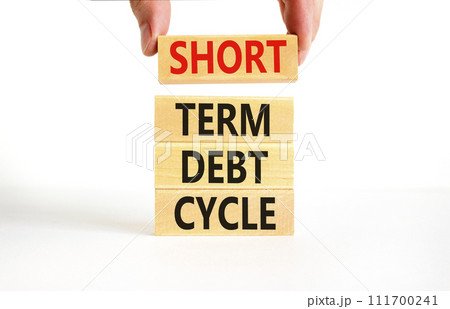 Short term debt cycle symbol. Concept words Short term debt cycle on beautiful wooden block. Beautiful white table background. Businessman hand. Business Short term debt cycle concept. Copy space. 111700241