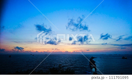 Kaohsiung, Taiwan - 08.09.2017: Sunset on the sea from Cihou Fort with a pier in the front 111701095