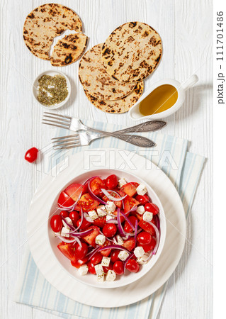 tomato salad with red onion and white cheese tomato salad with red onion and white cheese 111701486