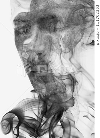 A double exposure male portrait combined with a smoke swirl texture A double exposure male portrait combined with a smoke swirl texture 111702363