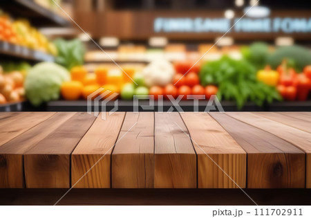 Empty table top with supermarket blurred defocused panorama, bokeh light. Backdrop for display or montage products. Blank wood textured counter with blur grocery, market store background. Front view 111702911