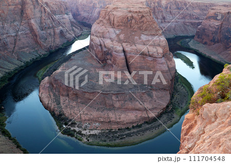 River Flowing Through Canyon Surrounded by Mountains 111704548