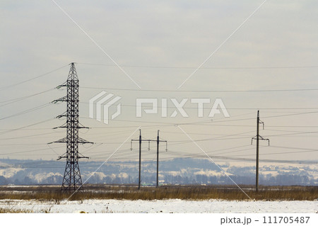 High power powerline poles with high voltage cables through the field 111705487