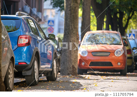 Close up of a car parked illegally against traffic rules on pedestrian city street side 111705794