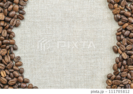 Burlap Sackcloth Canvas and Coffee Beans Placed Round Photo Background. Copy Space. Coffee Border Burlap Sackcloth Canvas and Coffee Beans Placed Round Photo Background. Copy Space. Coffee Border 111705812
