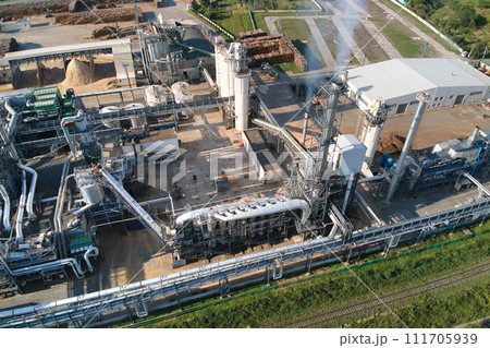 Aerial view of oil and gas refining petrochemical factory with tall refinery plant manufacture structure. Aerial view of oil and gas refining petrochemical factory with tall refinery plant manufacture structure. 111705939