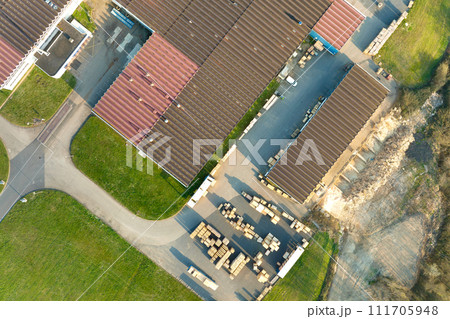Aerial view of modern factory structure for production and distribution of industrial equipment. Concept of global industry Aerial view of modern factory structure for production and distribution of industrial equipment. Concept of global industry 111705948