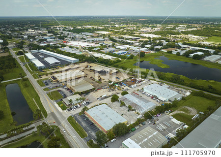 Aerial view of industrial park with goods warehouses and logistics centers in city zone from above Aerial view of industrial park with goods warehouses and logistics centers in city zone from above 111705970
