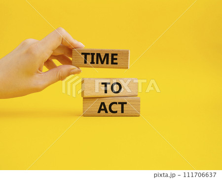 Time to Act symbol. Wooden blocks with words Time to Act. Beautiful yellow background. Businessman hand. Business and Time to Act concept. Copy space. Time to Act symbol. Wooden blocks with words Time to Act. Beautiful yellow background. Businessman hand. Business and Time to Act concept. Copy space. 111706637