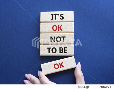 Mental Health symbol. Wooden blocks with words It is ok not to be ok. Doctor hand. Beautiful deep blue background. Mental Health concept. Copy space. 111706854
