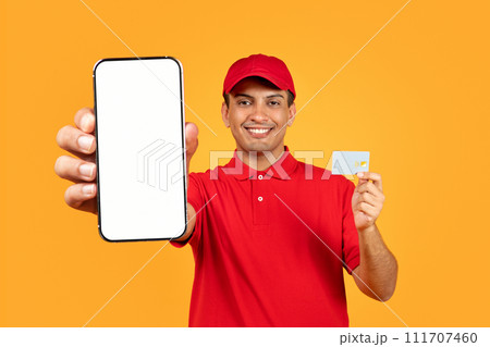 courier showcasing empty smartphone template and credit card, yellow background courier showcasing empty smartphone template and credit card, yellow background 111707460
