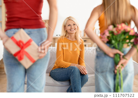 Daughter and granddaughter with a secret gift 111707522